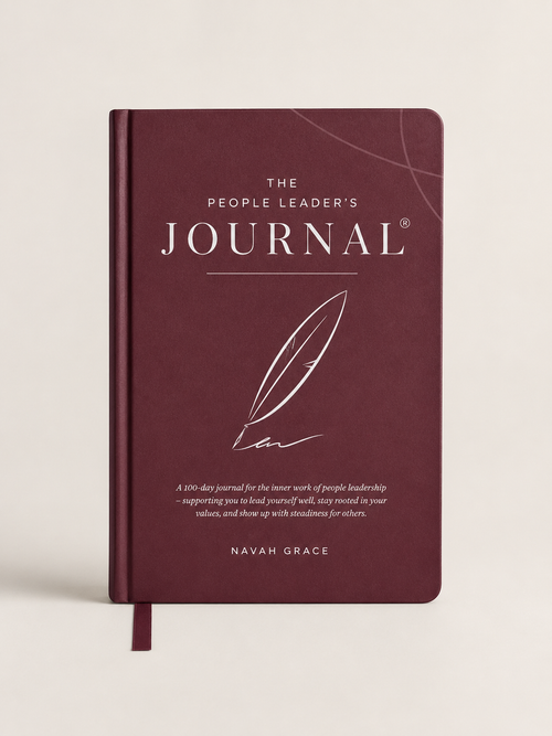 The People Leader's Journal by Navah Grace, featuring a deep burgundy cover with elegant white typography and a feather illustration, shown on a light beige background.